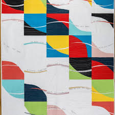 A quilt with square patterns.