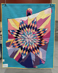 A quilt with star patterns.